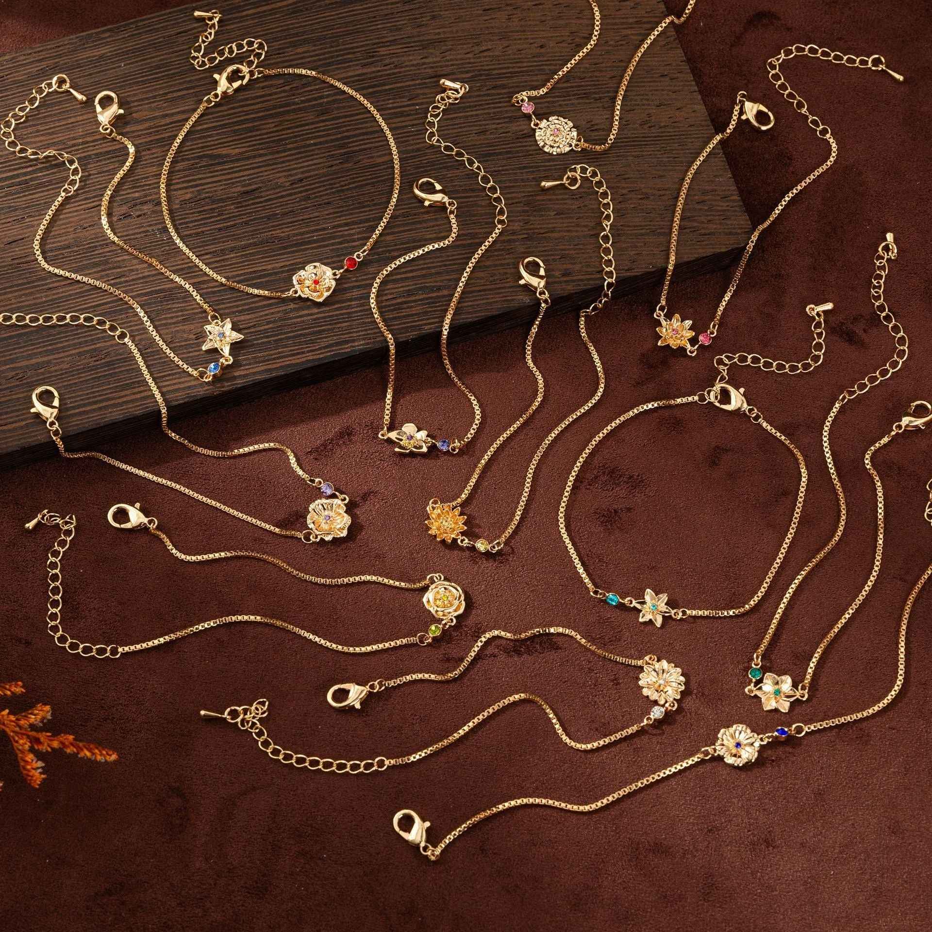 Birthstone bracelet with flower charm and cubic zirconia pendant