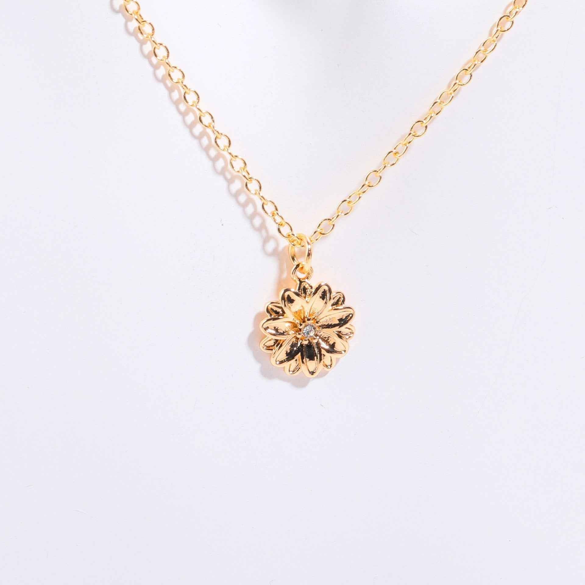 Birthstone bracelet with flower charm and cubic zirconia pendant