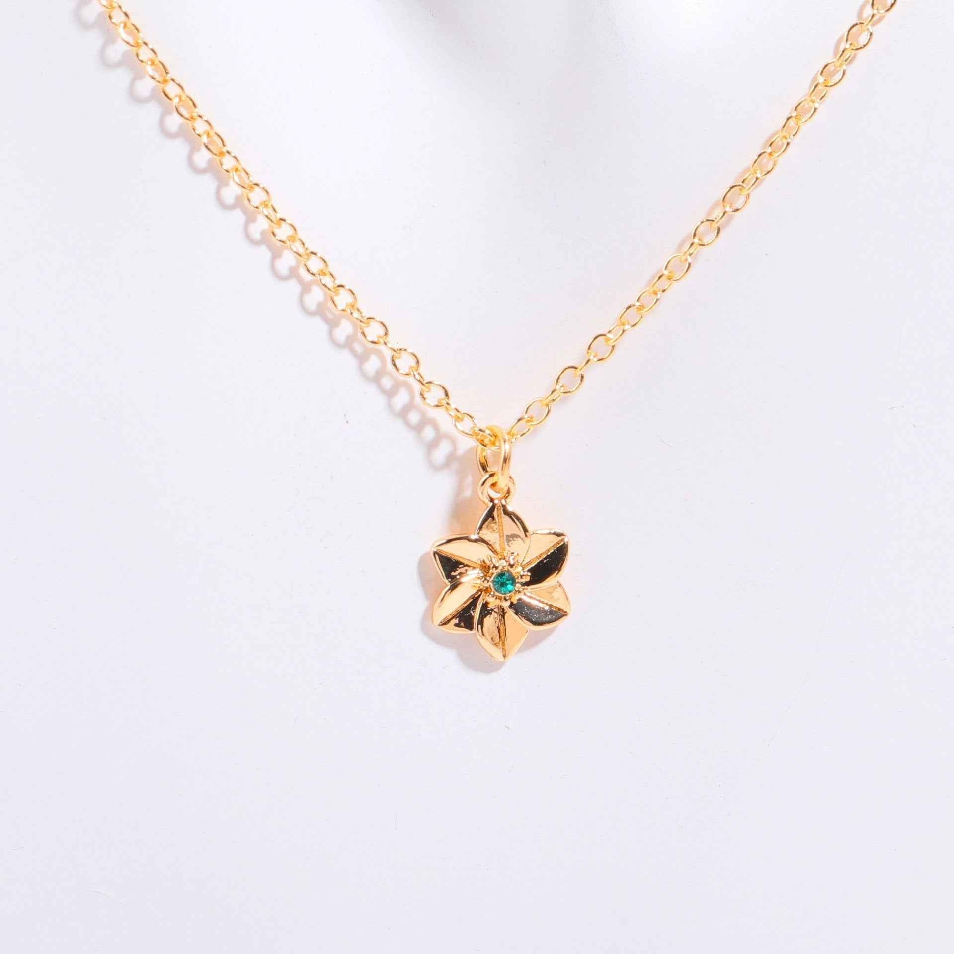 Birthstone bracelet with flower charm and cubic zirconia pendant