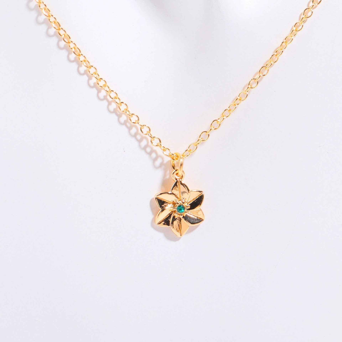 Birthstone bracelet with flower charm and cubic zirconia pendant