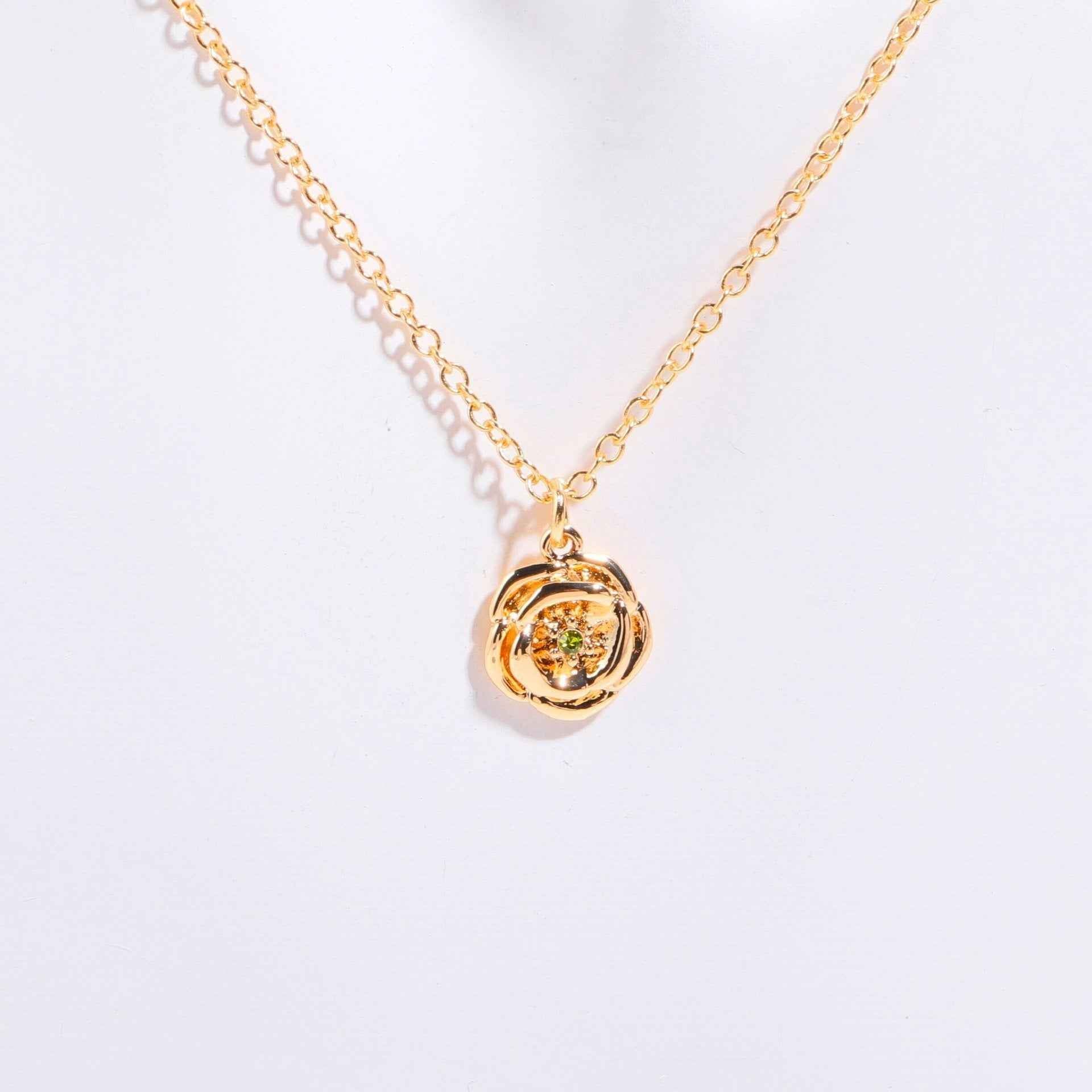 Birthstone bracelet with flower charm and cubic zirconia pendant