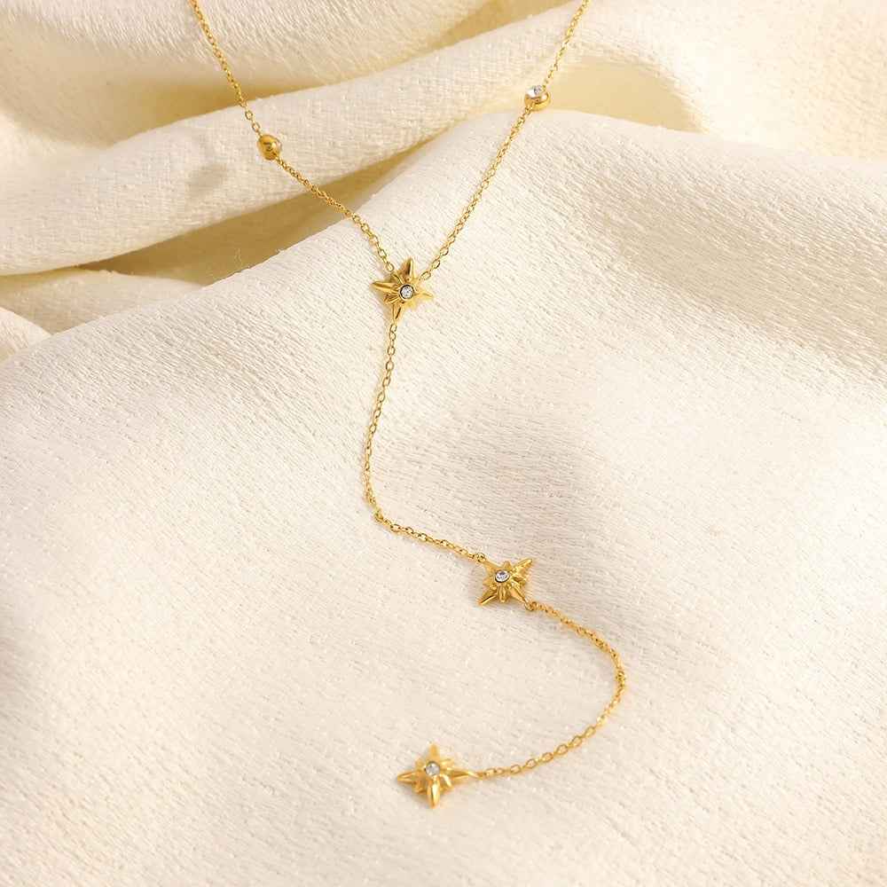 18K gold-plated titanium steel necklace with an eight-pointed star pendant and inlaid diamonds.