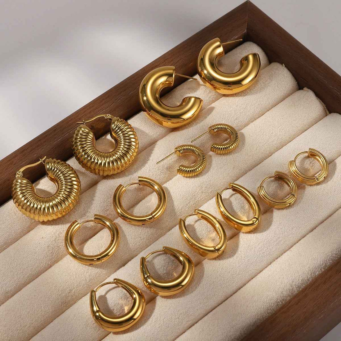 18K gold-plated, lightweight, and luxurious titanium steel stud earrings.