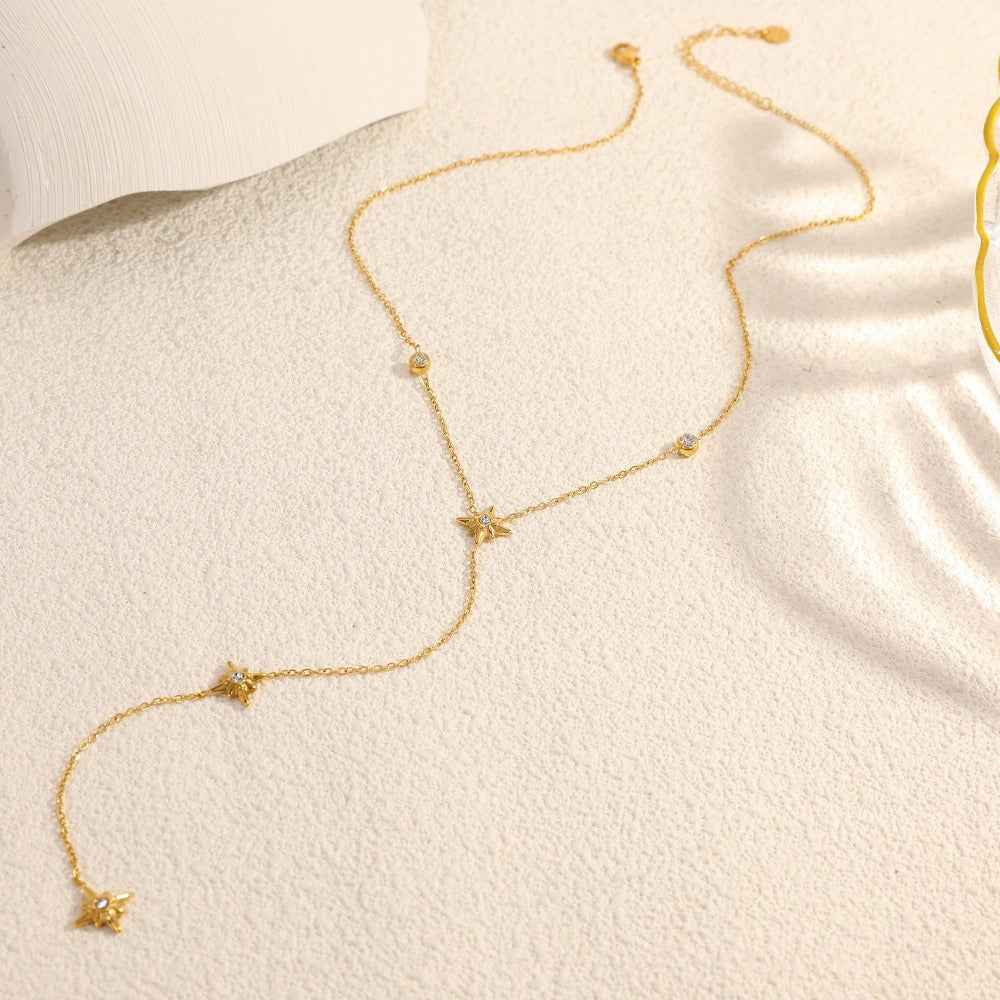 18K gold-plated titanium steel necklace with an eight-pointed star pendant and inlaid diamonds.