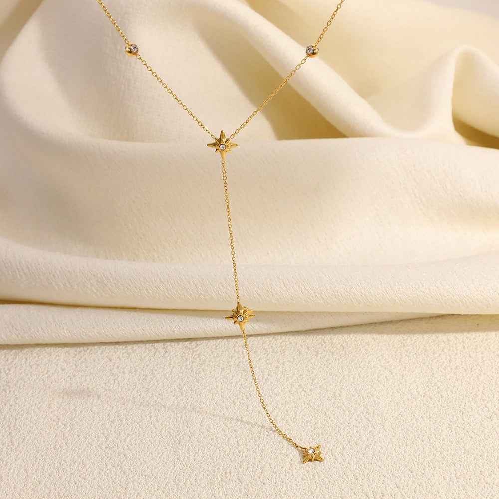 18K gold-plated titanium steel necklace with an eight-pointed star pendant and inlaid diamonds.