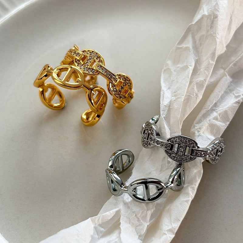 Gold and silver colored pig nose design open ring with full rhinestones for the index finger.