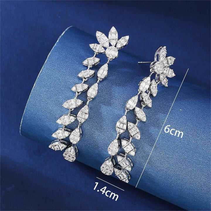 Floral design, fully encrusted with diamonds, double chain leaf earrings.