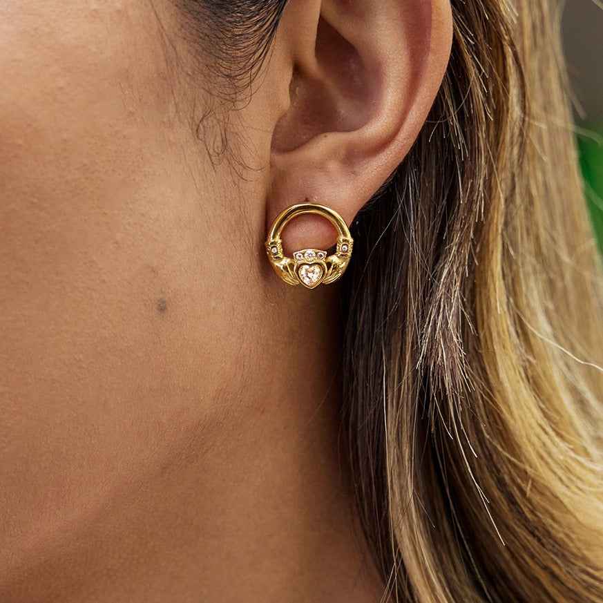 18K gold-plated friendship hand design titanium steel stud earrings with cubic zirconia.