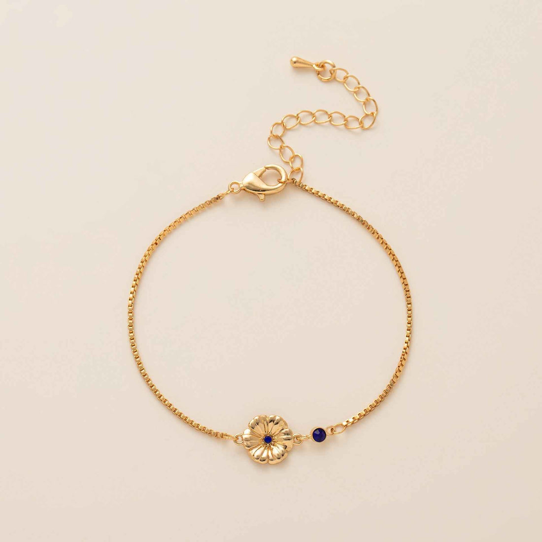 Birthstone bracelet with flower charm and cubic zirconia pendant