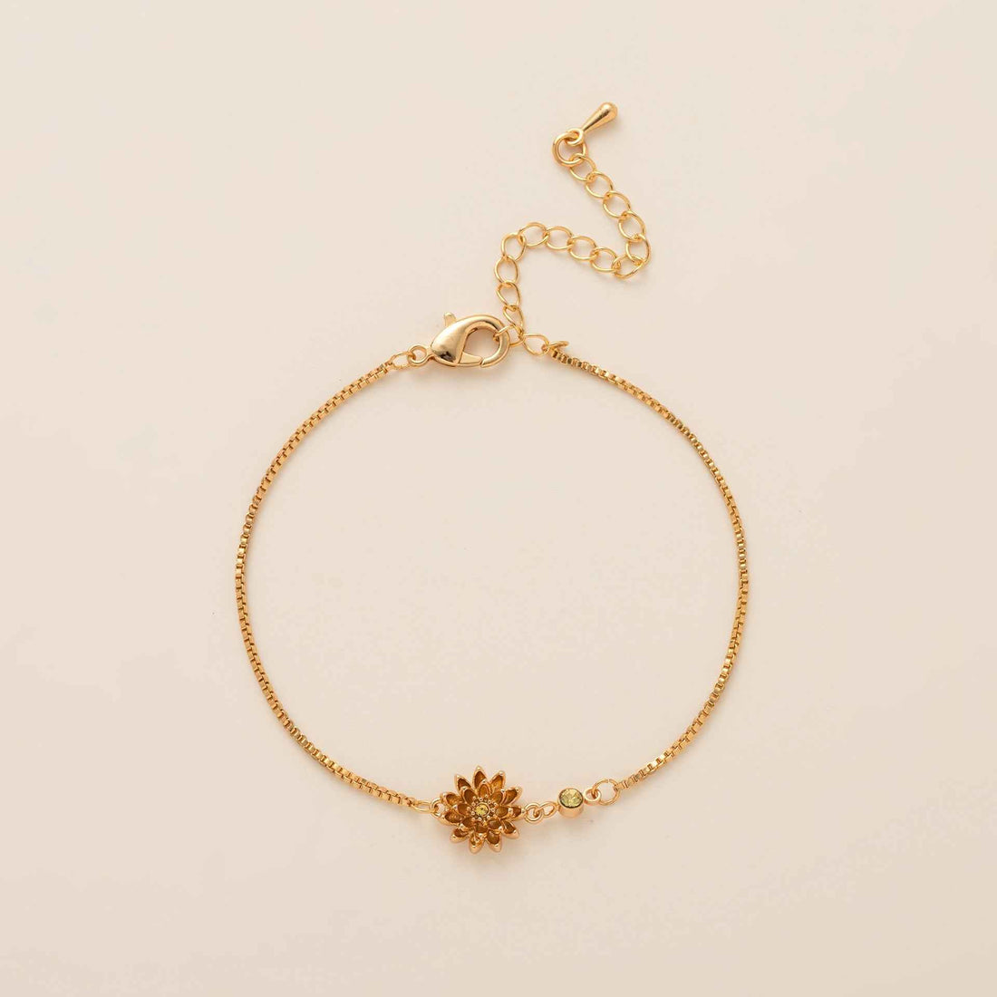 Birthstone bracelet with flower charm and cubic zirconia pendant