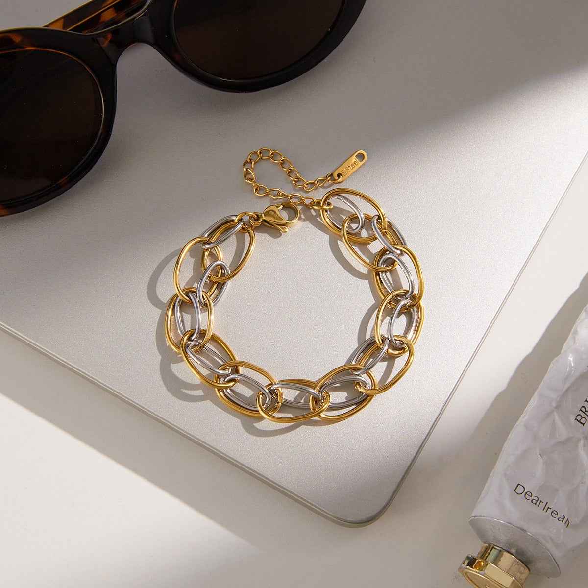 18K gold-plated, lightweight, and luxurious two-tone titanium steel bracelet.