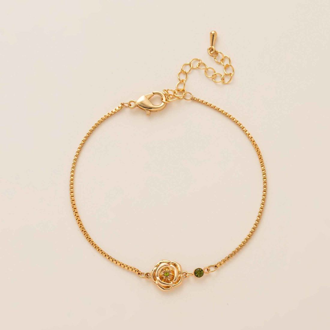 Birthstone bracelet with flower charm and cubic zirconia pendant
