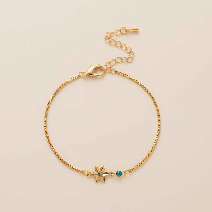 Birthstone bracelet with flower charm and cubic zirconia pendant