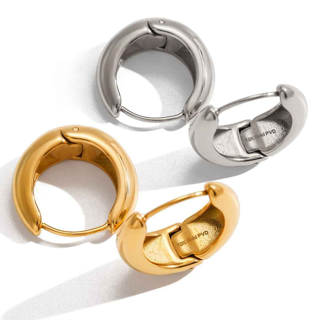 18K gold lightweight luxury earrings with engraved lettering on the inner surface.