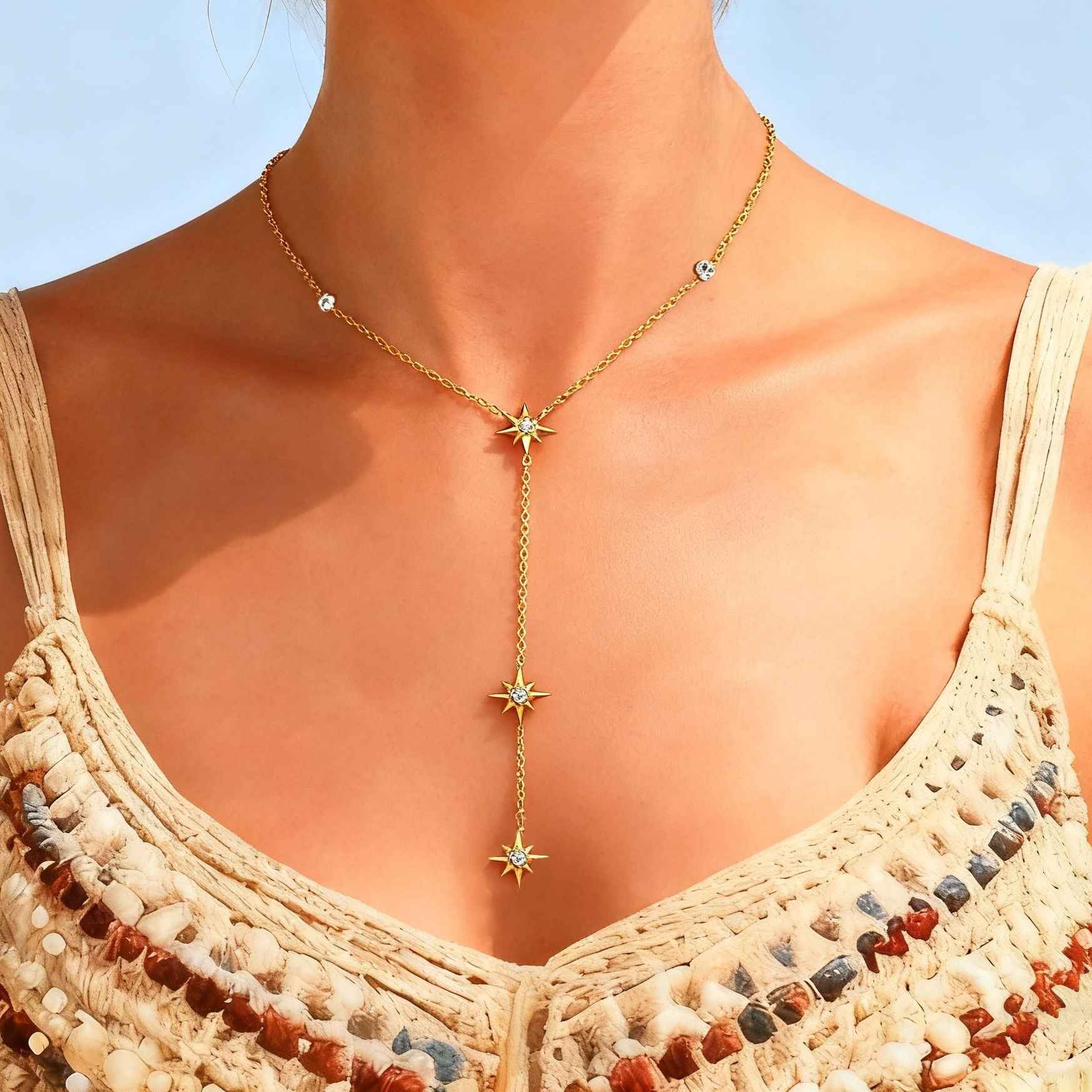 18K gold-plated titanium steel necklace with an eight-pointed star pendant and inlaid diamonds.