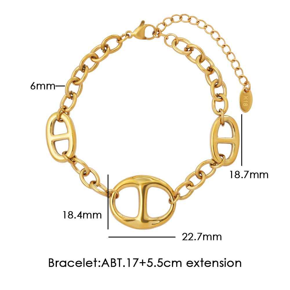 18K gold geometric-shaped necklace, bracelet, and earrings set.