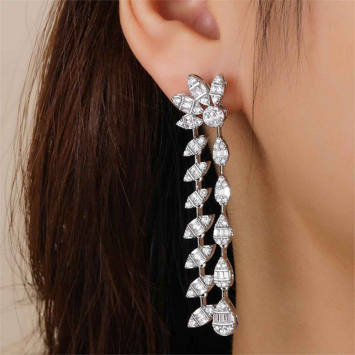 Double chain leaf-shaped earrings with full diamond embellishments