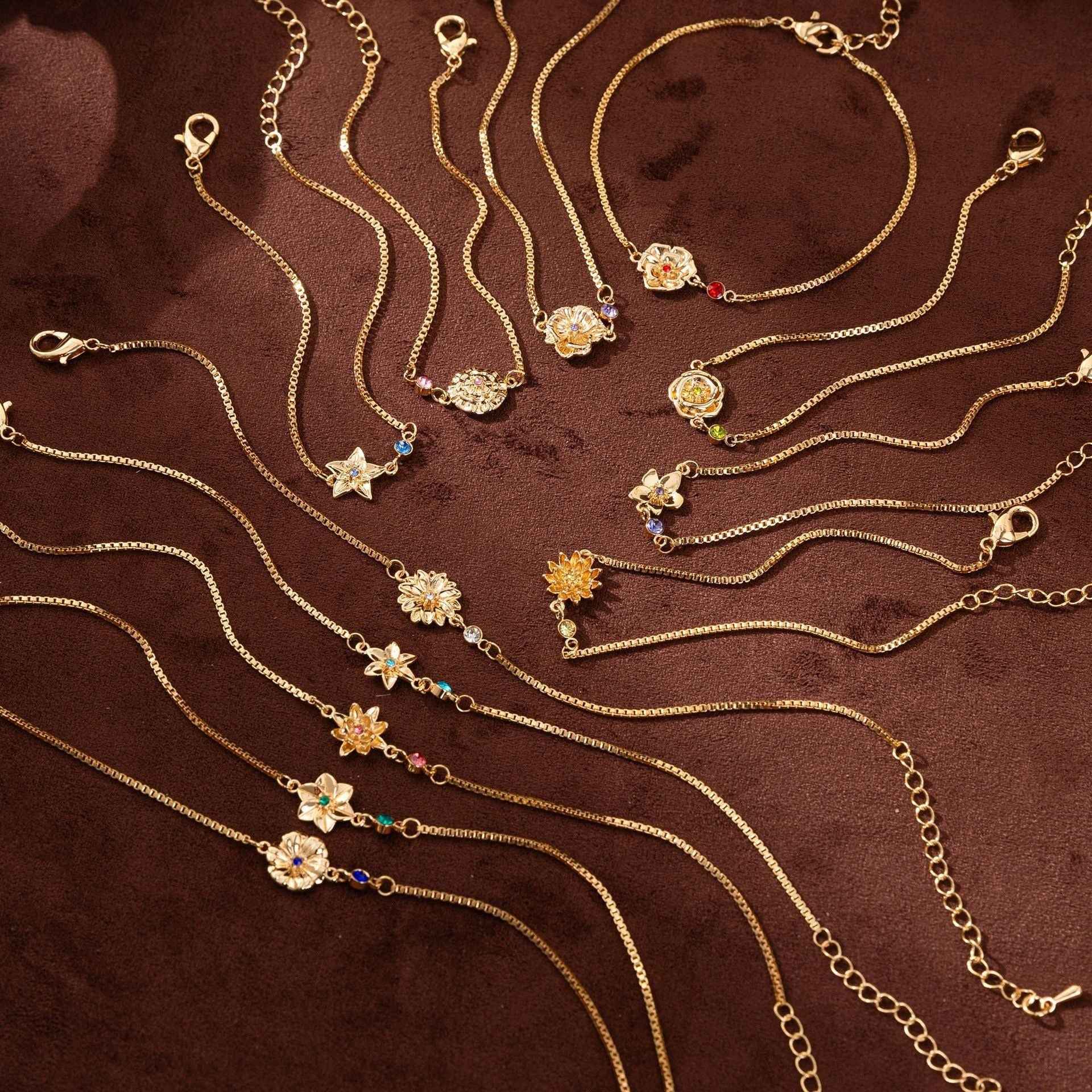 Birthstone bracelet with flower charm and cubic zirconia pendant