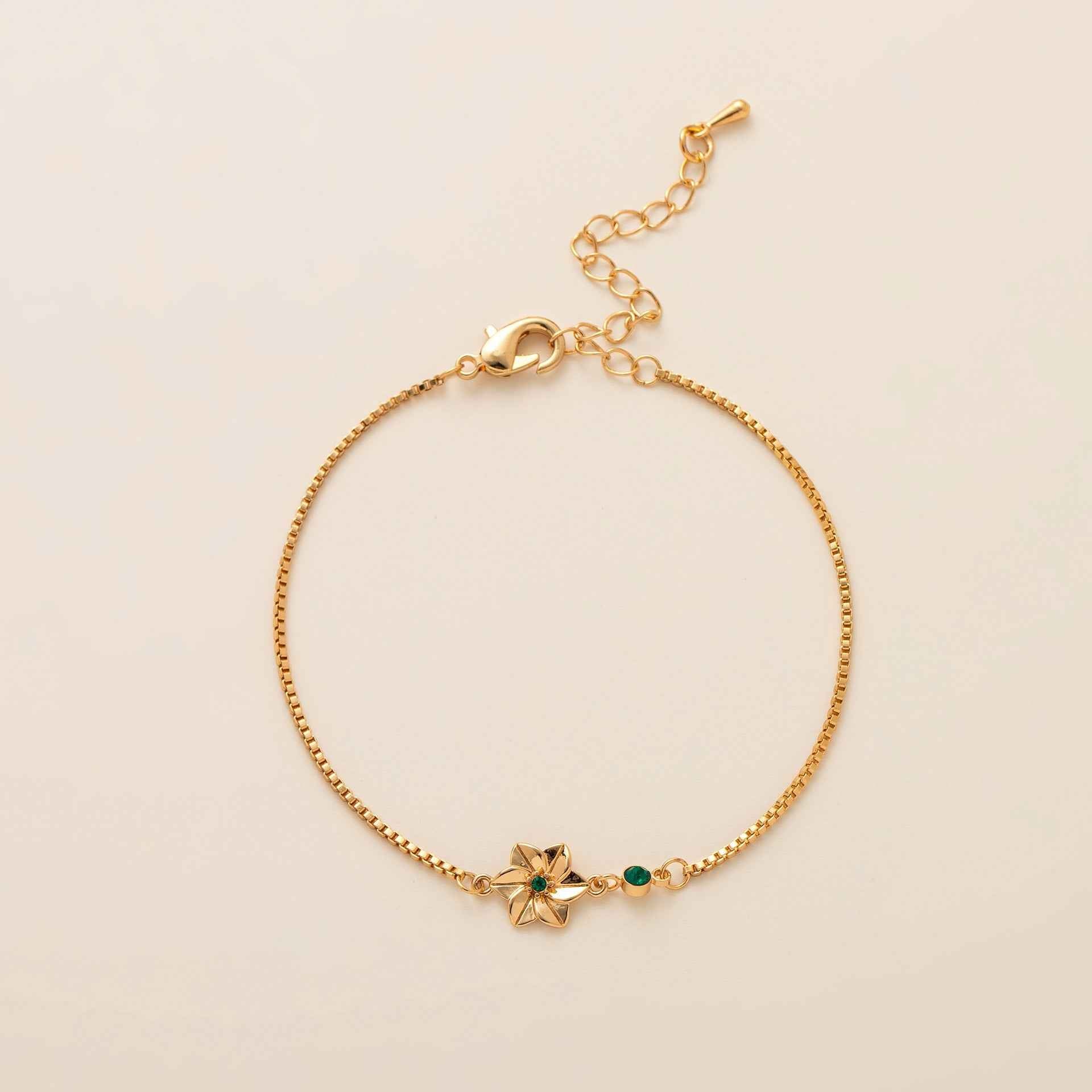 Birthstone bracelet with flower charm and cubic zirconia pendant