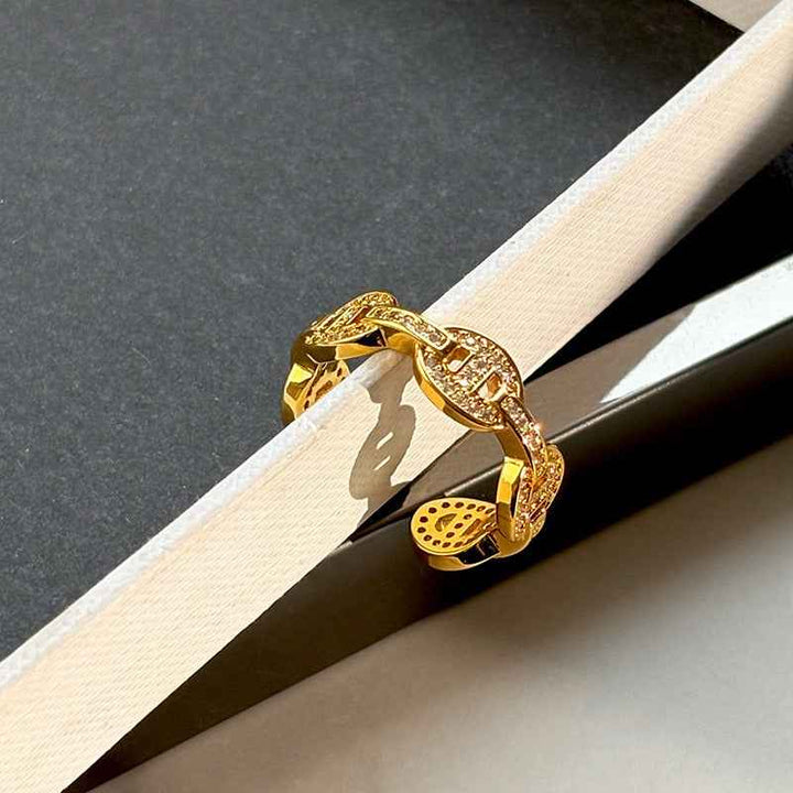 Gold and silver colored pig nose design open ring with full rhinestones for the index finger.