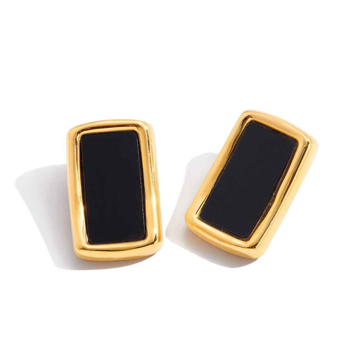 18K gold, black acrylic, and titanium steel stud earrings.