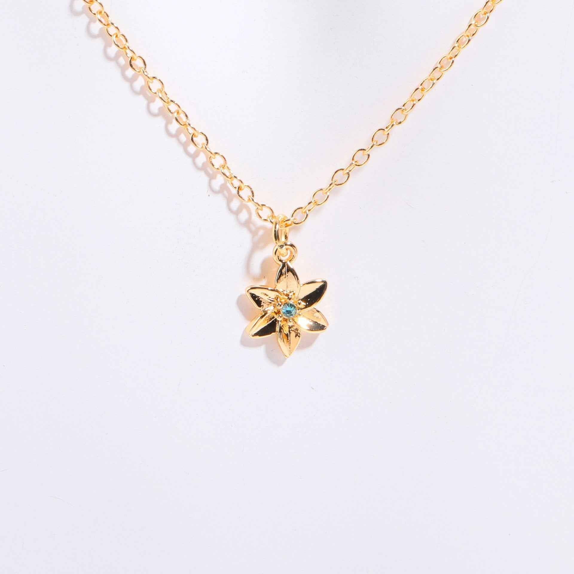 Birthstone bracelet with flower charm and cubic zirconia pendant