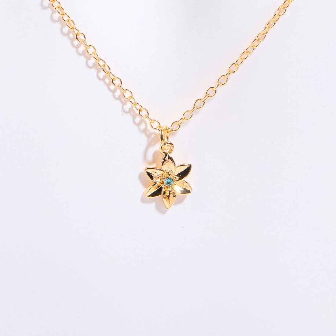 Birthstone bracelet with flower charm and cubic zirconia pendant