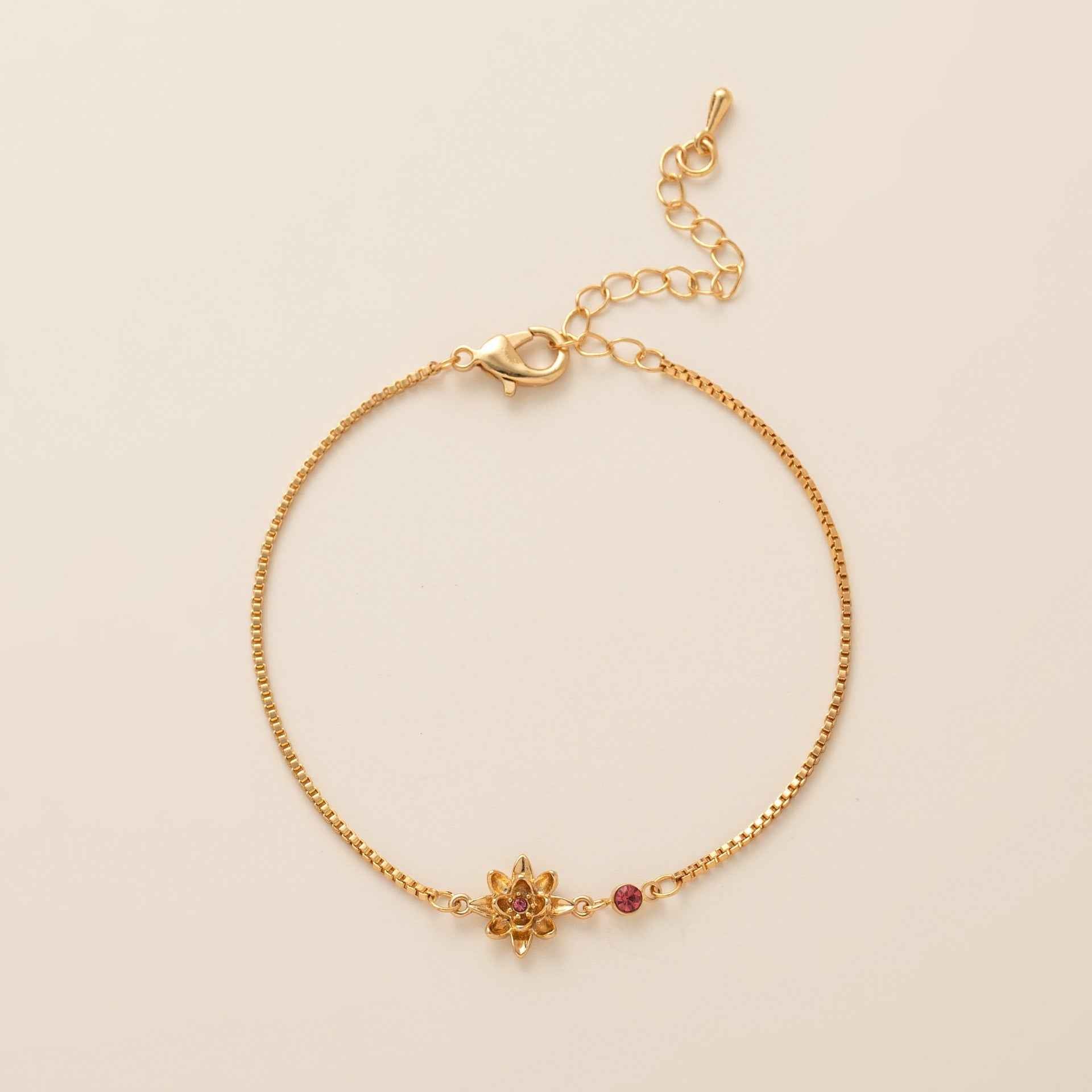 Birthstone bracelet with flower charm and cubic zirconia pendant