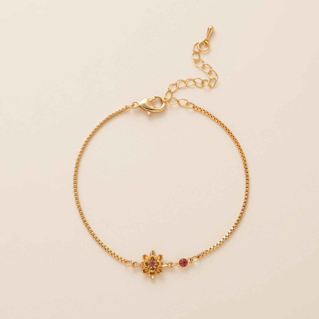 Birthstone bracelet with flower charm and cubic zirconia pendant